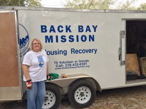 Woman standing in front of Back Bay Mission trailer