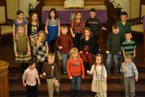 Kids standing on chancel in church
