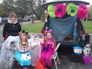 People standing behind car for Trunk or Treat